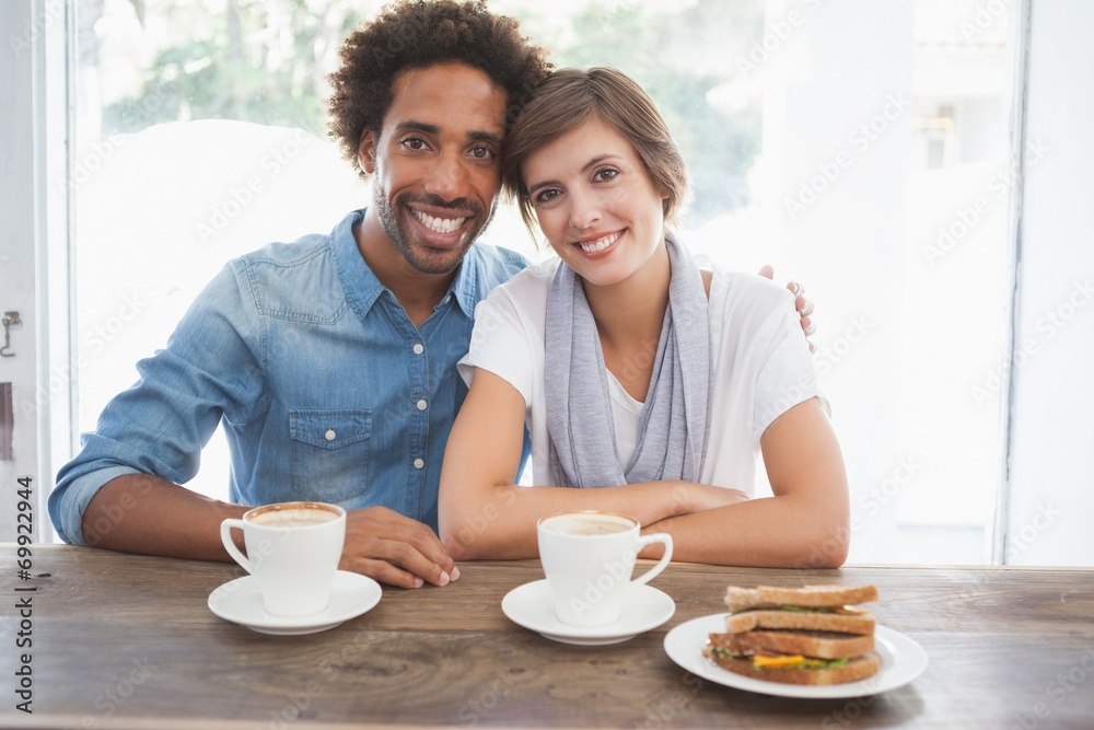 Casual couple having coffee together