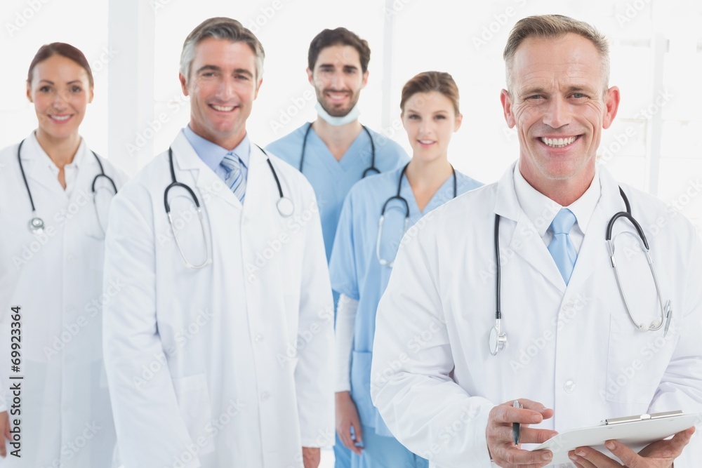 Smiling doctors all standing together Smiling doctors all standing together