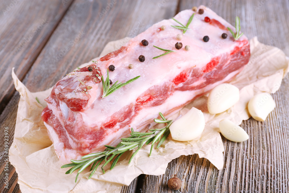 raw bacon with spices on wooden table raw bacon with spices on wooden table