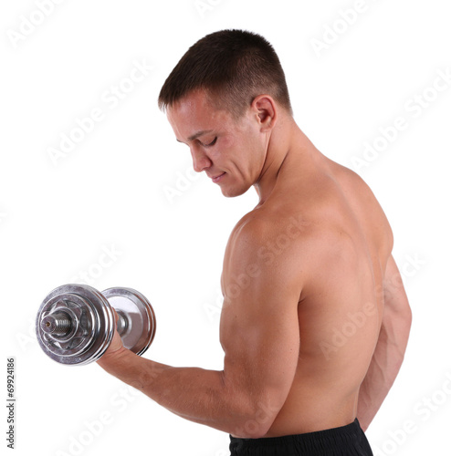 Young muscular sportsman execute exercise with dumbbell