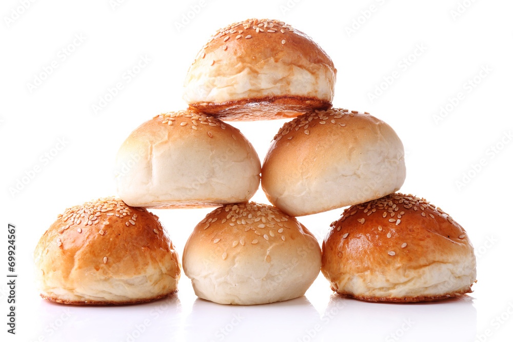 Tasty buns with sesame isolated on white