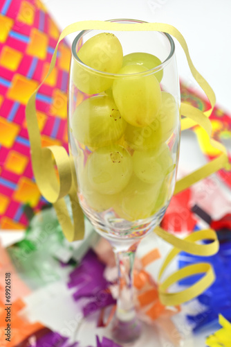 Fresh green grapes in glass for new year celebration party time