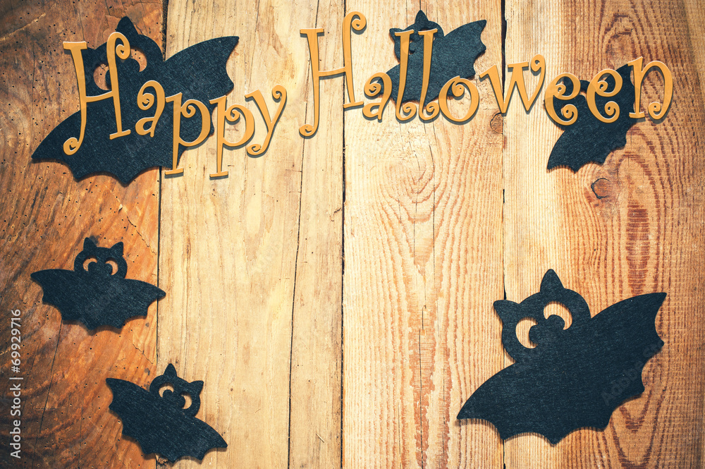 Naklejka premium Halloween background on a wooden table