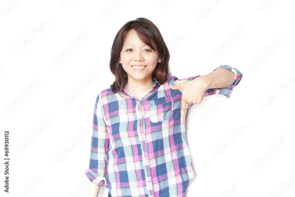 Young smiling Japanese woman pointing her finger Young smiling Japanese woman pointing her finger