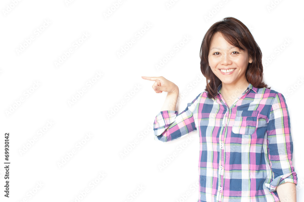 Young smiling Japanese woman pointing her finger Young smiling Japanese woman pointing her finger