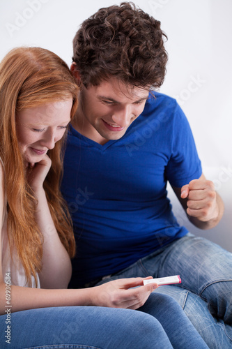 Young couple with a pregnancy test