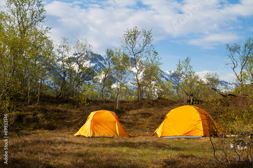 two tourist tents in mountains