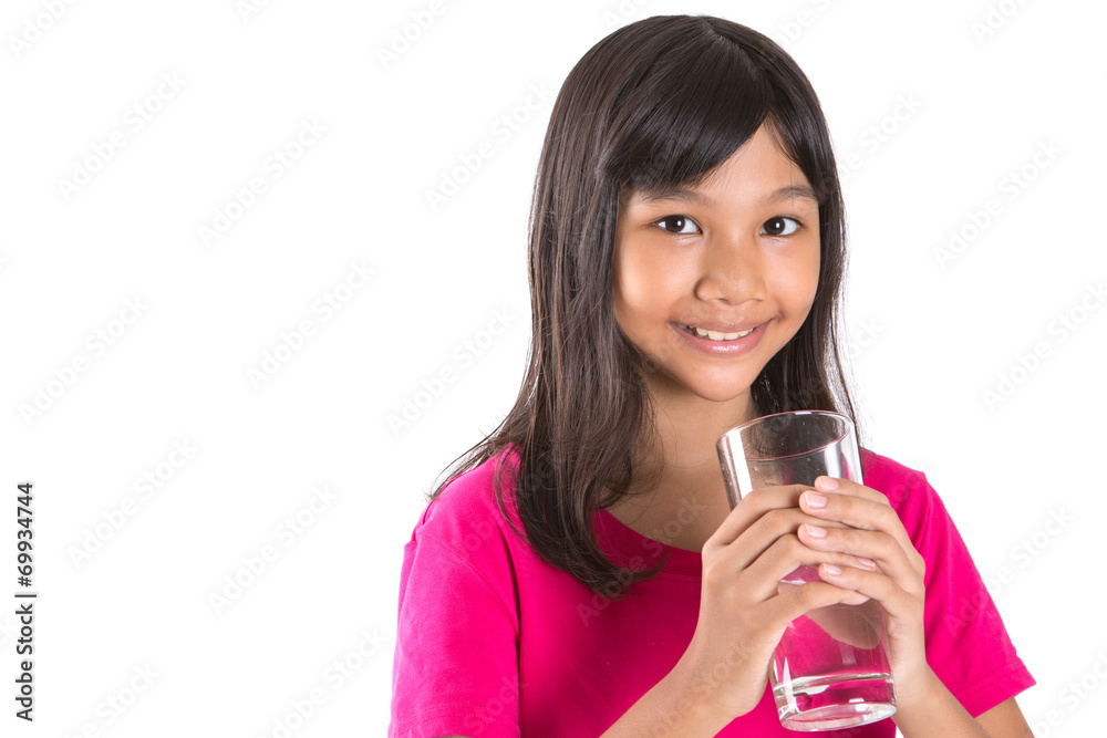 Young Asian preteen with a glass of water over white background Young Asian preteen with a glass of water over white background