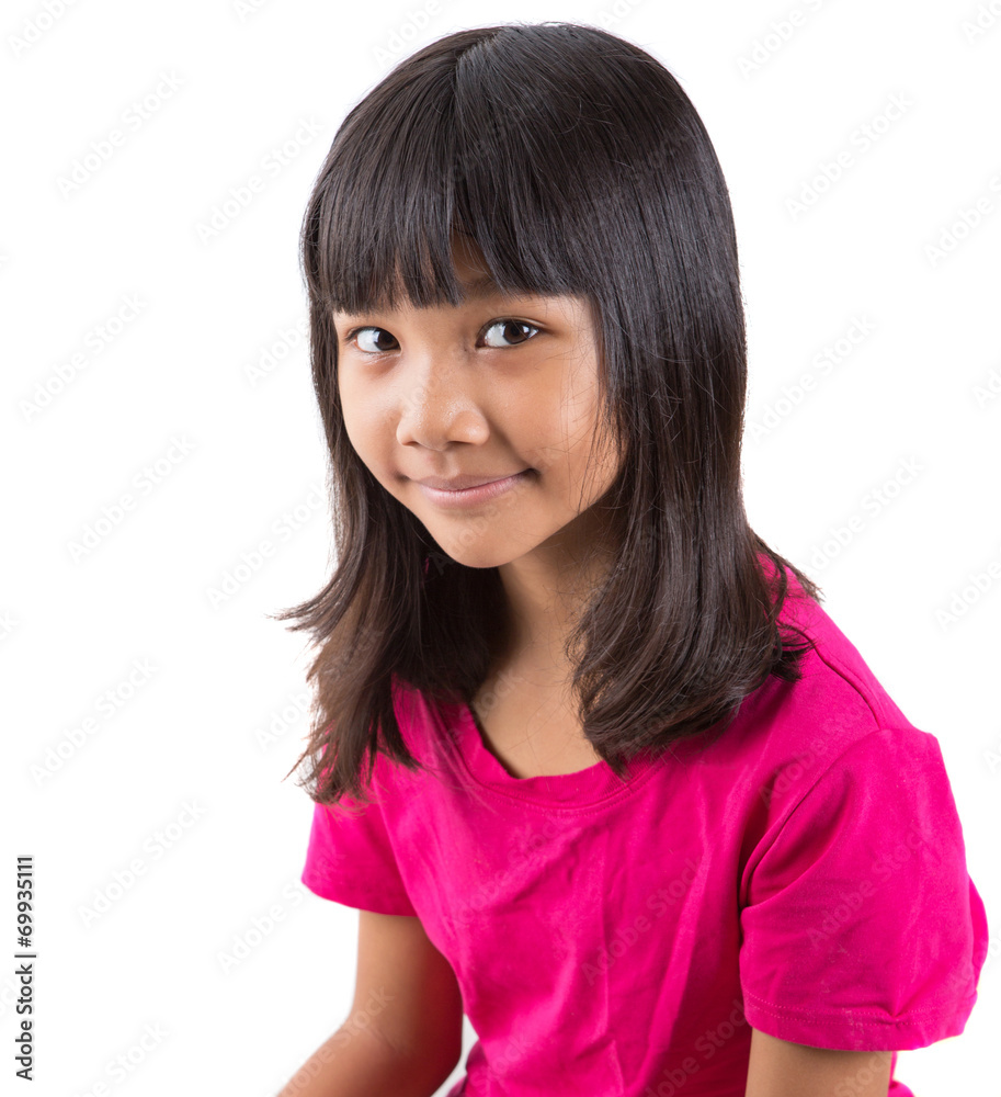 Young Asian preteen girl in pink t-shirt over white background Young Asian preteen girl in pink t-shirt over white background