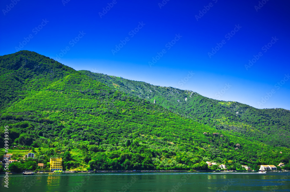 Blue sky above seaside and mountains