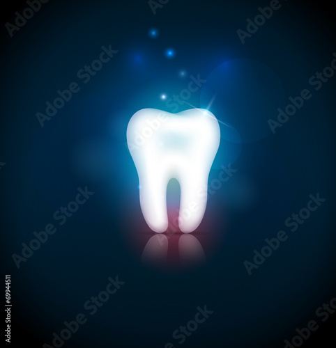 White tooth on a blury blue background with light shades