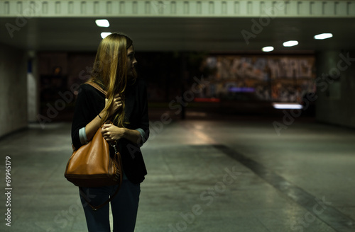 Lonely woman in the underpass