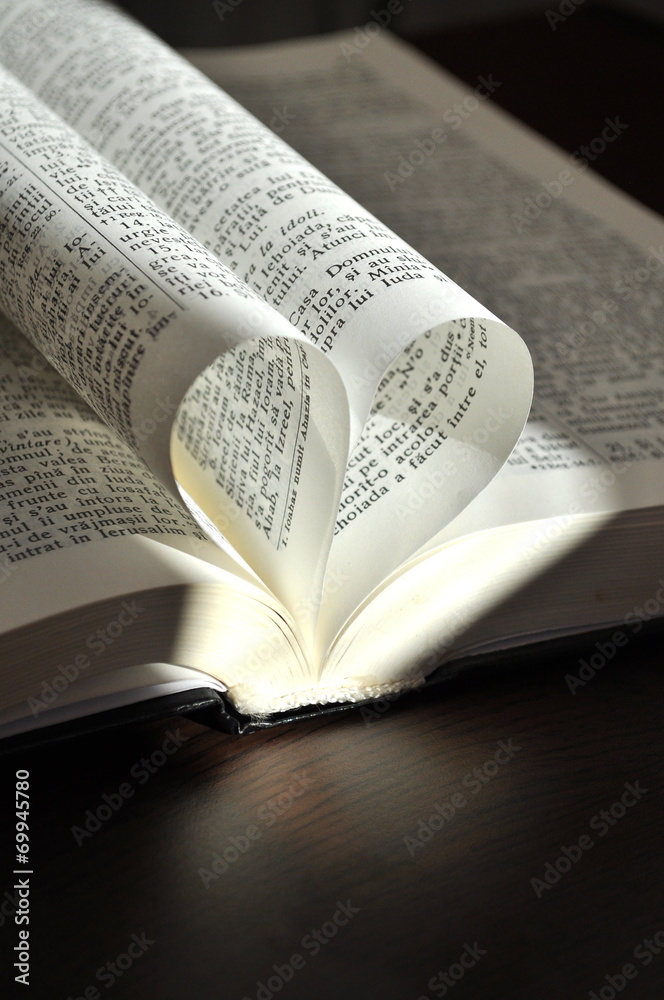 Fototapeta premium Closeup pages of an open book, with heart shaped pages