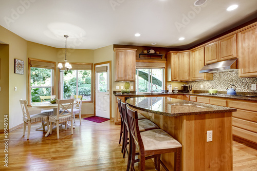 Modern kitchen rooom with island and granite tops