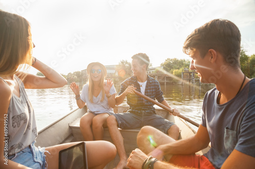 Friends Enjoying On A Boat