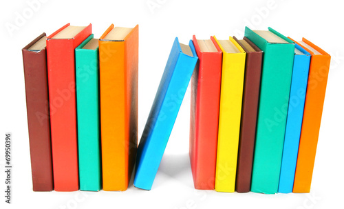 Multi-coloured books. On white background.