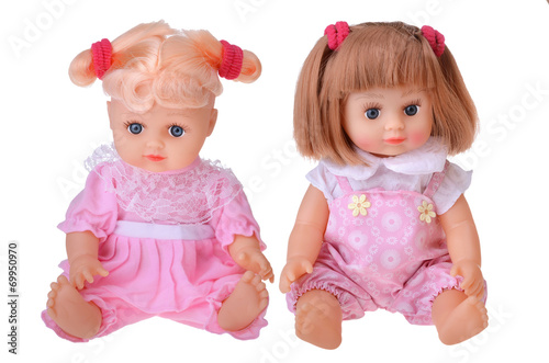 Billede på lærred Girls dolls sitting in colorful dress