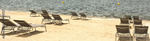 sun beds on desert beach