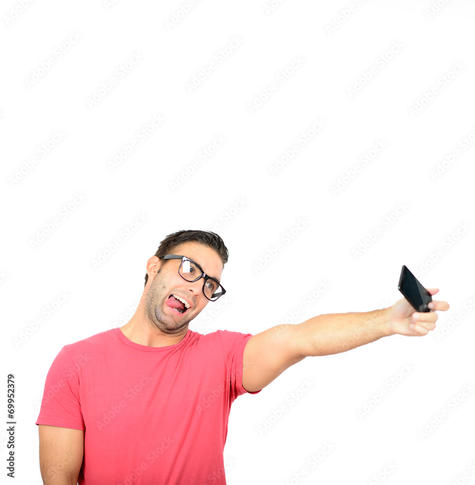 Closeup of young handsome man looking at smartphone and taking s