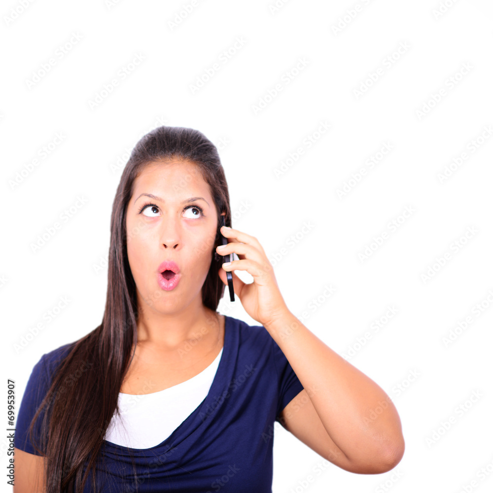 Beautiful woman talking on cellphone and being in shock of news Beautiful woman talking on cellphone and being in shock of news