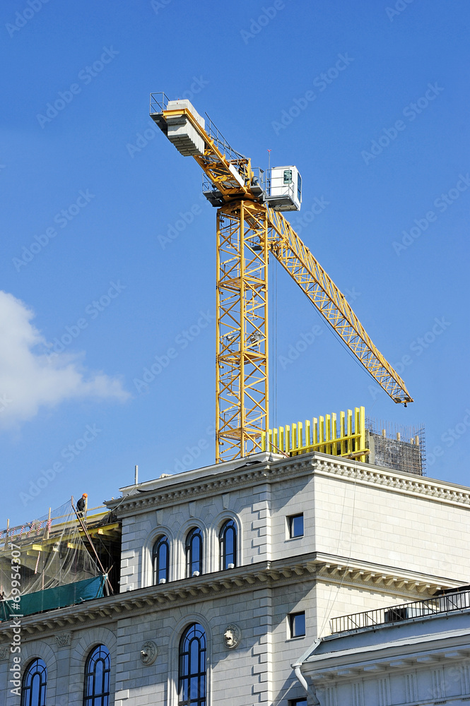 crane construction completes attic