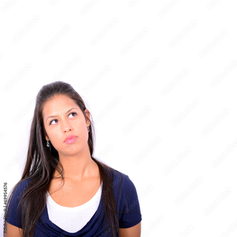 Portrait of beautiful girl thinking and looking up against white Portrait of beautiful girl thinking and looking up against white
