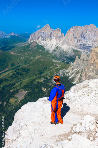 BASE jumper jumping off a big cliff in Dolomites,Italy, breathta