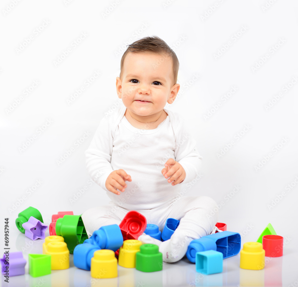Beautiful baby girl with colorful toys - Studio shot Beautiful baby girl with colorful toys - Studio shot