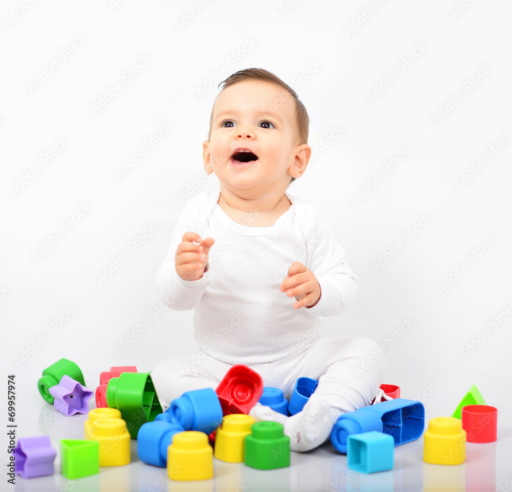 Beautiful baby girl with colorful toys - Studio shot Beautiful baby girl with colorful toys - Studio shot