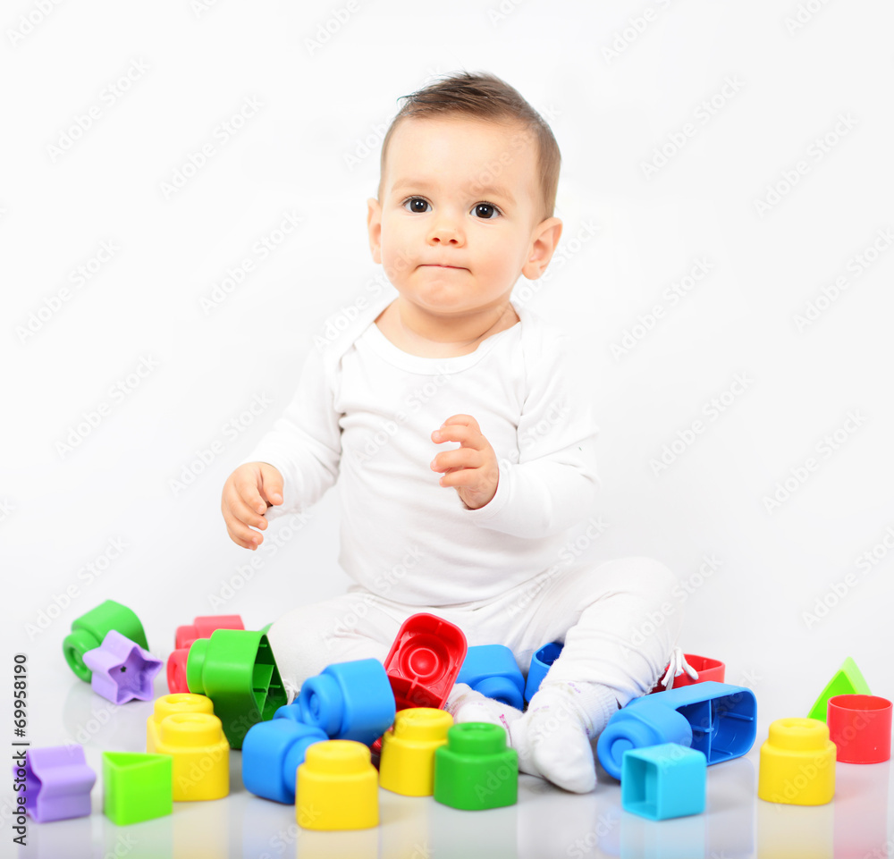 Beautiful baby girl with colorful toys - Studio shot Beautiful baby girl with colorful toys - Studio shot