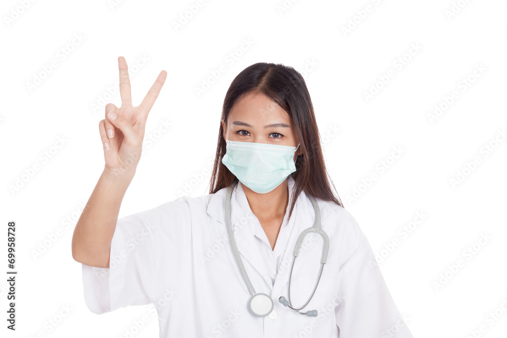 Young Asian female doctor show victory sign Young Asian female doctor show victory sign