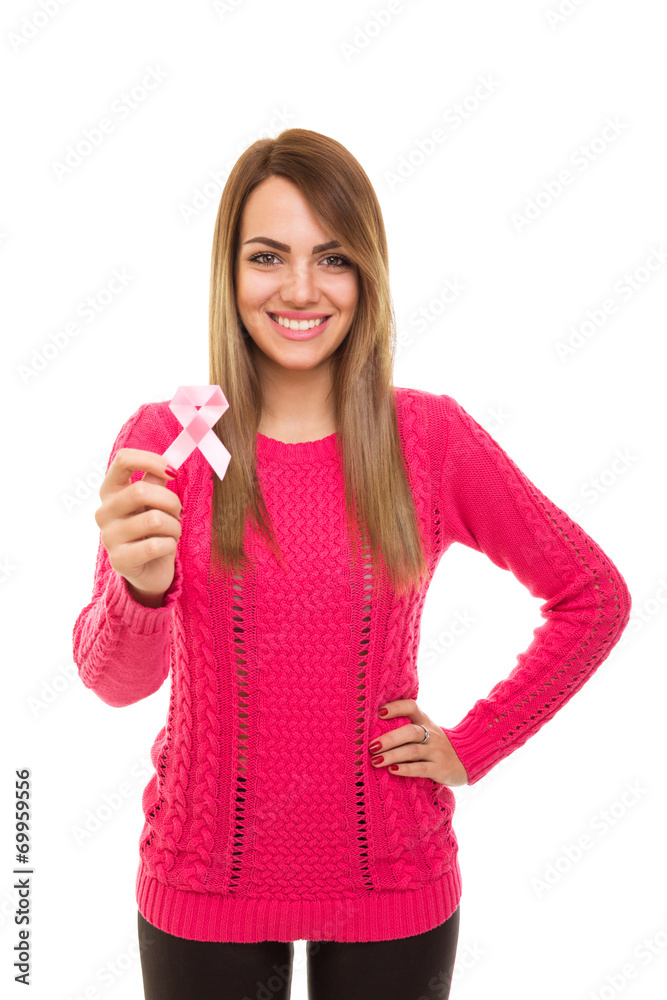 Beautiful young woman showing pink breast cancer ribbon Beautiful young woman showing pink breast cancer ribbon
