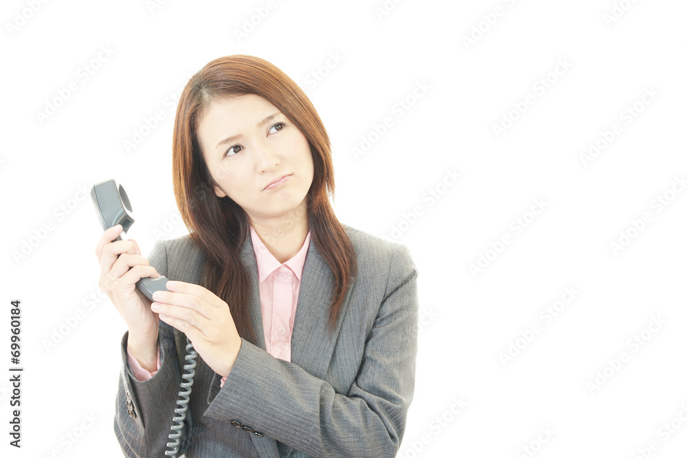 疲れた表情のOL