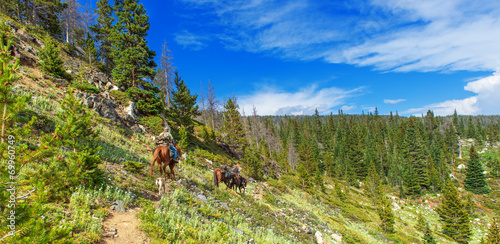 Trail riding in the Rocky Mountains photo