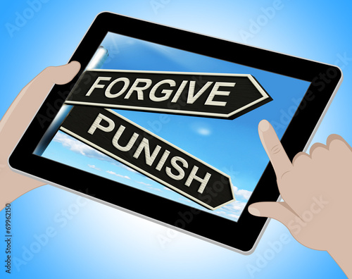 Fotografie Forgive Punish Tablet Means Forgiveness Or Punishment