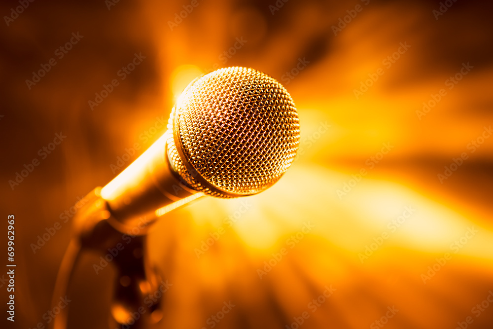 Obraz premium golden microphone on stage
