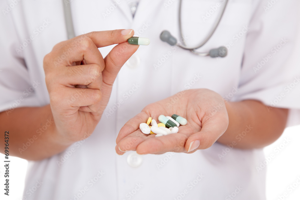 Doctor pick a capsule from palm hand Doctor pick a capsule from palm hand