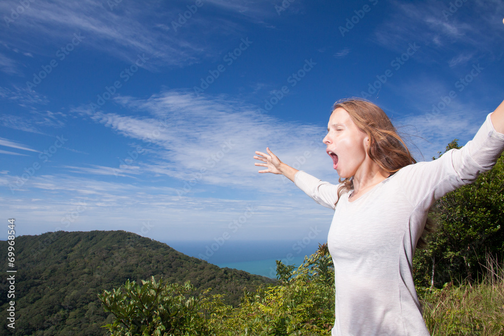woman screams in the mountains