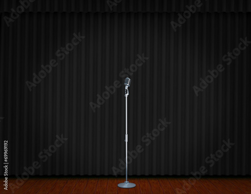 vintage microphone on Theater stage with curtains and spotlights Theatrical scene in the light of searchlights, the interior of the old theater