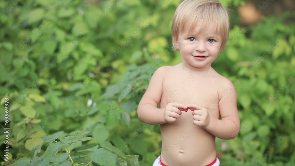 Baby with raspberries Baby with raspberries