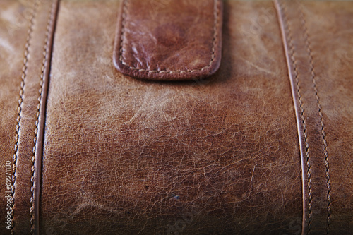 Very close up of brown leater purse photo