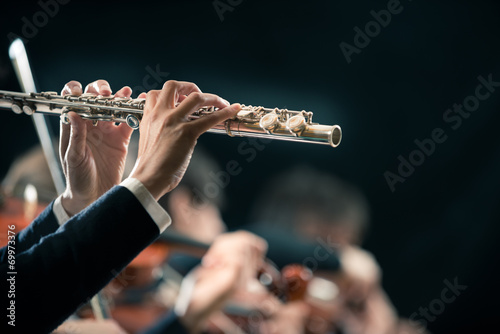 Symphony orchestra performance: flutist close-up