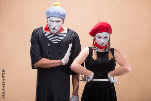 Couple of two funny mimes isolated on background photo