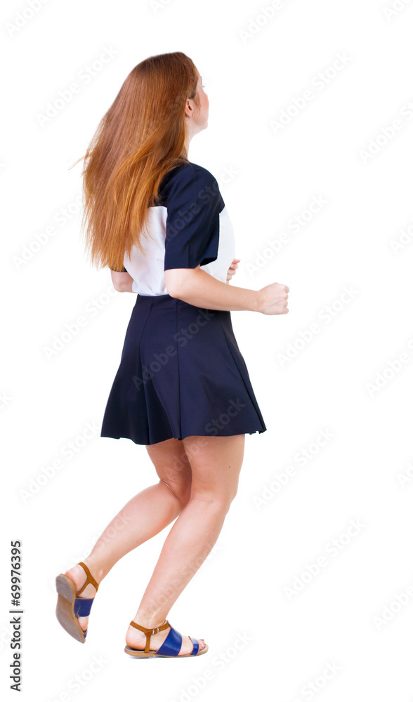 back view of running woman in dress back view of running woman in dress