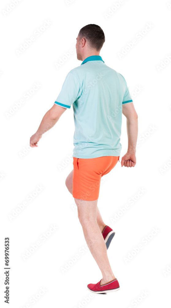 Back view of running sportsman. Back view of running sportsman.