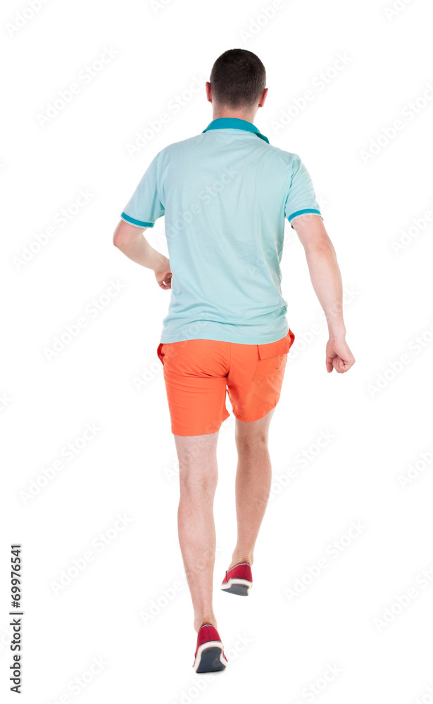 Back view of running sportsman. Back view of running sportsman.