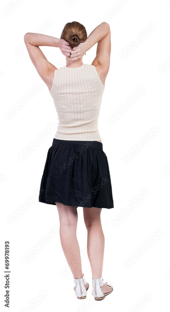 Fototapeta premium back view of standing young beautiful woman.