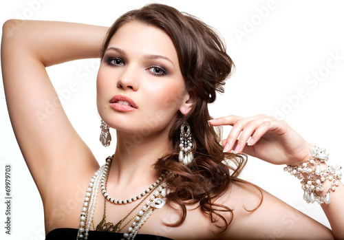 Beautiful young woman in necklace