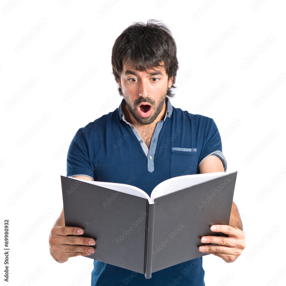 Man reading a book over white background Man reading a book over white background