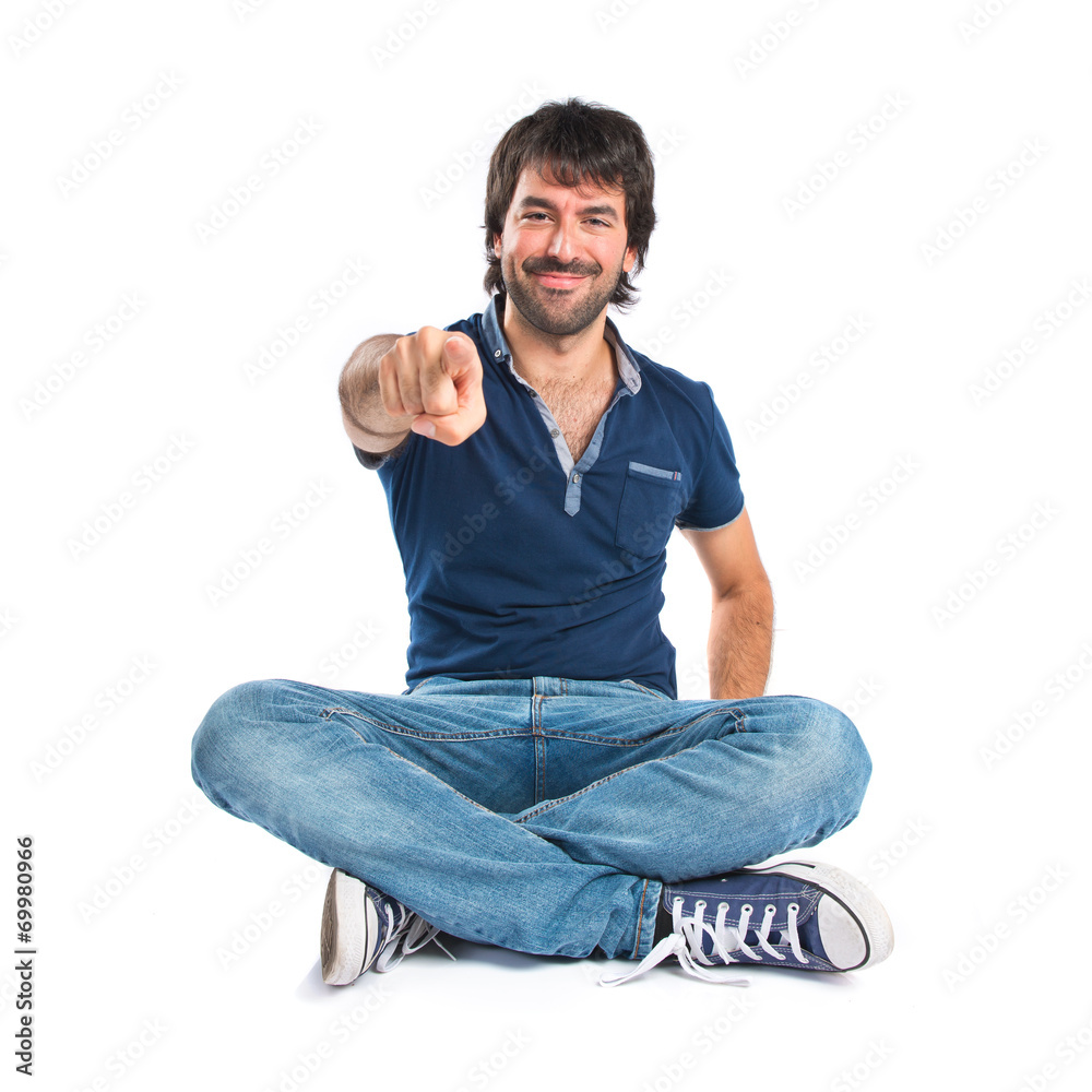 Man pointing to the front over white background Man pointing to the front over white background